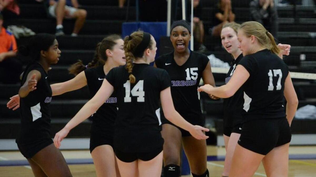 Destiny Cox (15) of Carrboro celebrates a point along her teammates. The Carrboro Jaguars played the Bartlett Yancey Buccaneers in a volleyball match that took place in Carrboro, N.C. on Wednesday, October 19, 2016. Carrboro won 3-0.