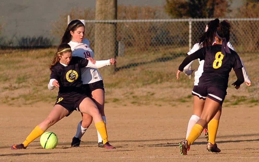 Northern's Autum Connors (9) fends of Esme Wheeler (19) of Jordan during a PAC-6 girls' soccer match on Thursday, March 16, 2017 at Jordan High School.