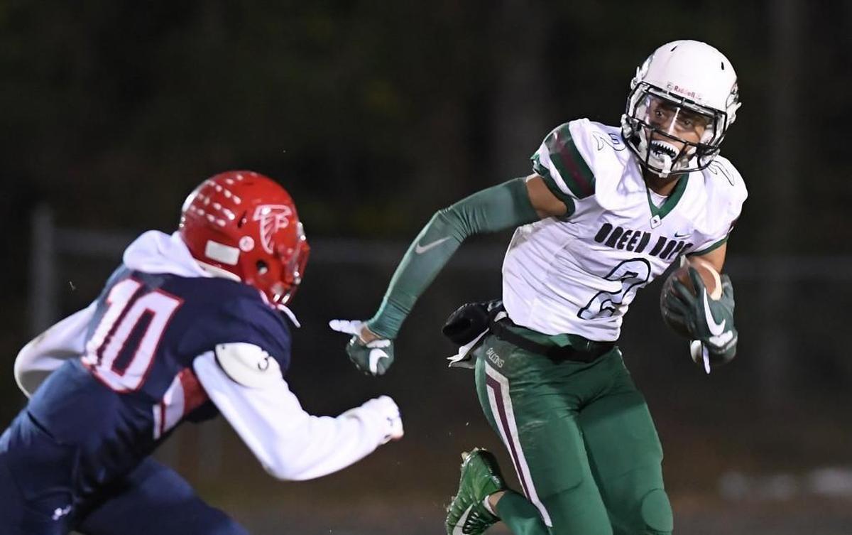 Jordyn Adams (2) of Green Hope moves the ball against the pursuit of Myles Speller (10) of Jordan. The Green Hope Falcons visited the Jordan Falcons in a high school football game on Oct. 27, 2017. Green Hope won 48-20.