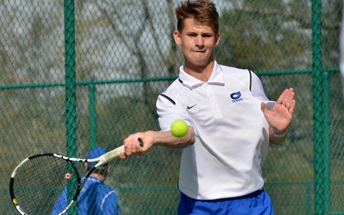Clayton’s Klein Evans dials in a forehand on the No. 1 doubles court during the Greater Neuse River 4A Conference boys tennis match at East Wake High in Wendell, N.C. Wednesday, March 23, 2016.
