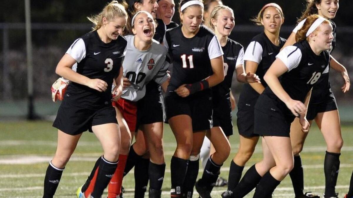Middle Creek celebrates their overtime goal against Cardinal Gibbons during the NCHSAA third round girls soccer playoff game, which was played in Raleigh on Wednesday, May 18, 2016. Middle Creek won 1-0 in overtime.