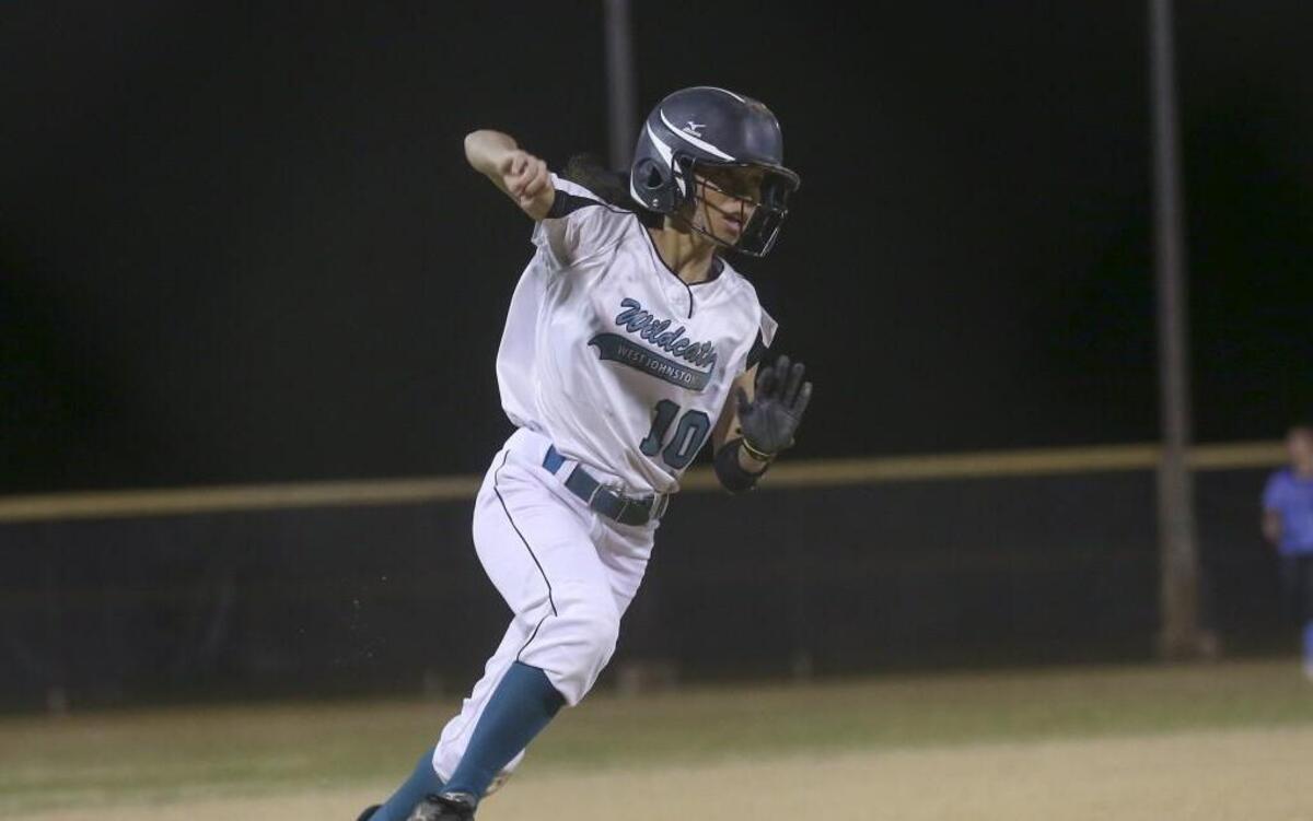West Johnston's Nadia Blevins (10) rounds third on her way to putting the Wildcats back in the lead in the bottom of the 6th inning on a hit by teammate Kaitlyn Tucker (2). Coverage from the prep softball game between the Cleveland High Rams and West Johnston High Wildcats played in Benson, N.C. on Wednesday, March 8, 2017. West Johnston defeated Cleveland 5-0.