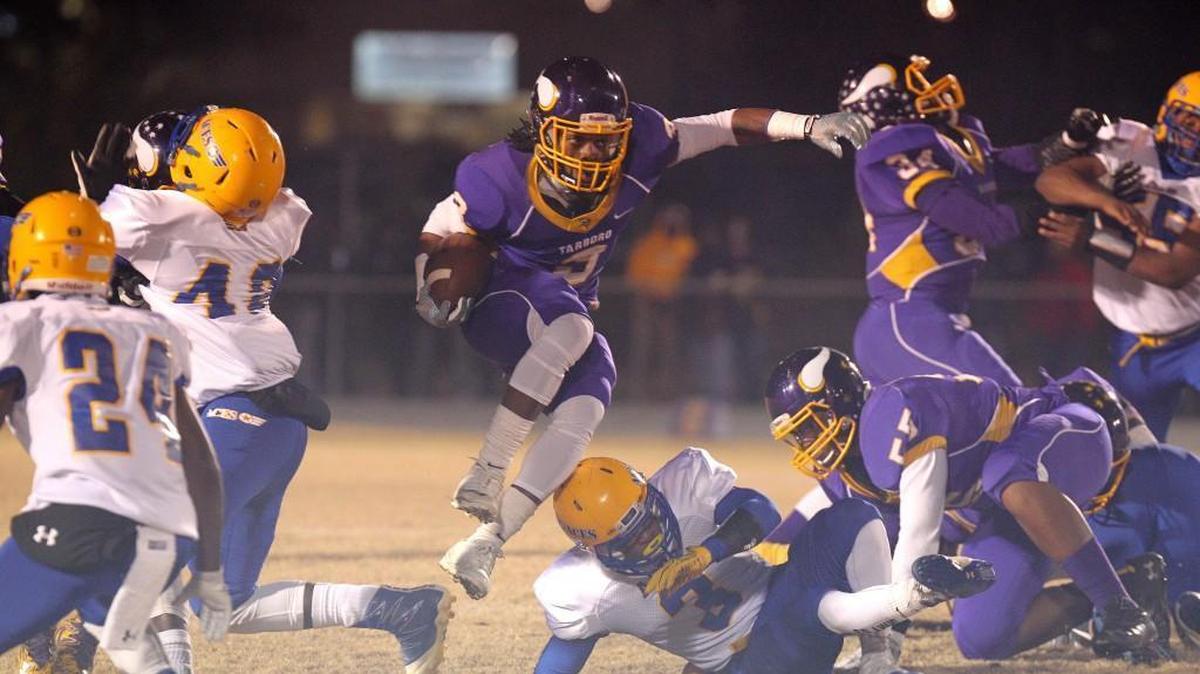 Tarboro's Deontae Williams (3) leaping over defender. The Edenton Holmes Aces visited the Tarboro Vikings in the 1AA East final in the NCHSAA high school football playoffs on Dec. 1, 2017.
