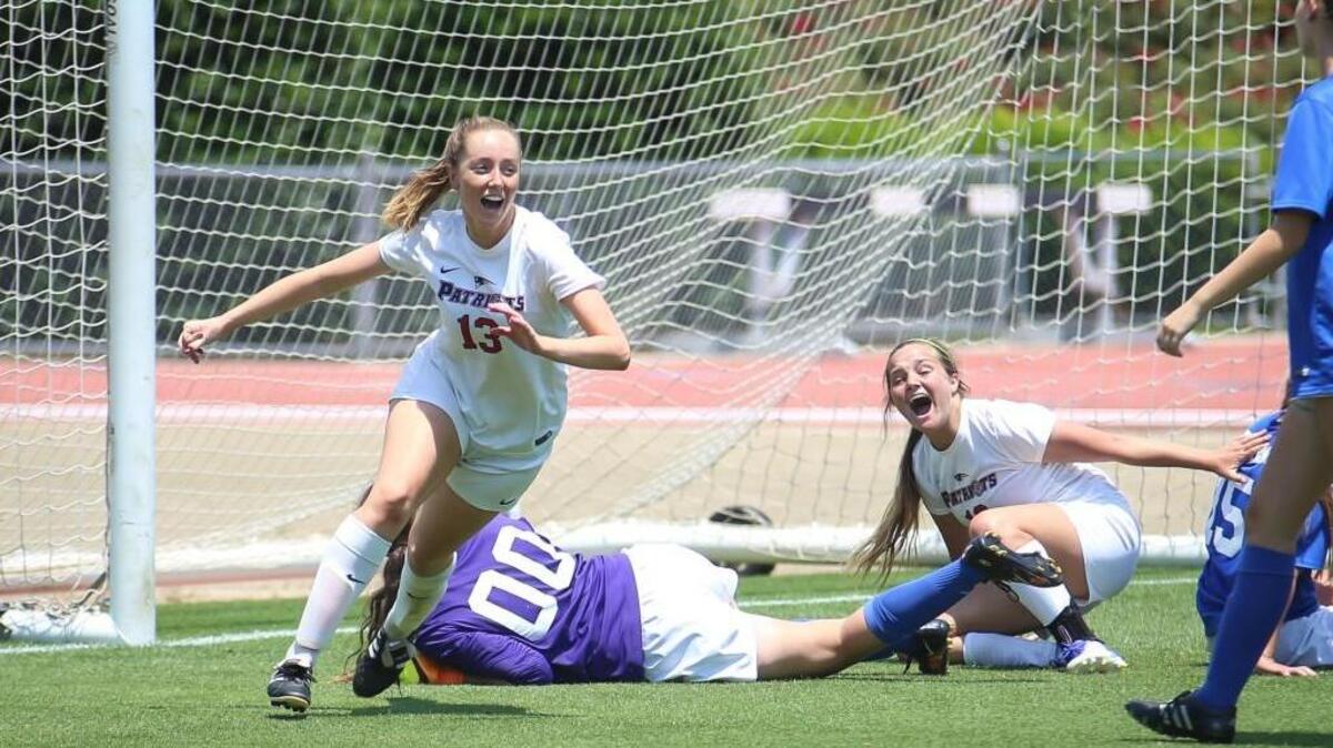 Franklin Academy's Chloe Armitage (13) celebrates after scoring with 33 seconds left in regulation to send the game to overtime during the NCHSAA 1A girls soccer state championship match between Franklin Academy and Community School of Davidson at NC State University on Saturday, May 27, 2017. Franklin Academy won the game 4-3 (4-3 on penalty kicks).