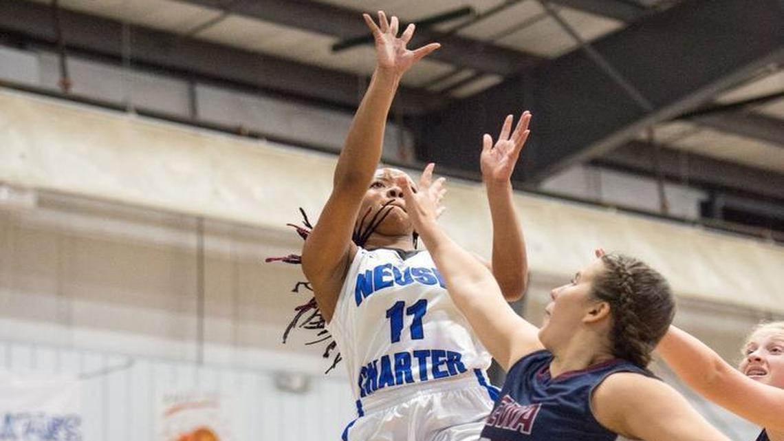 Neuse Charter's Kiondra Webb (11) scores another basket during matchup between East Wake Academy and Neuse Charter that took place at Neuse Charter School on December 5, 2016 in Smithfield, North Carolina. Neuse Charter girls defeated East Wake Academy 53-17. East Wake Academy boys defeated Neuse Charter 68-49.
