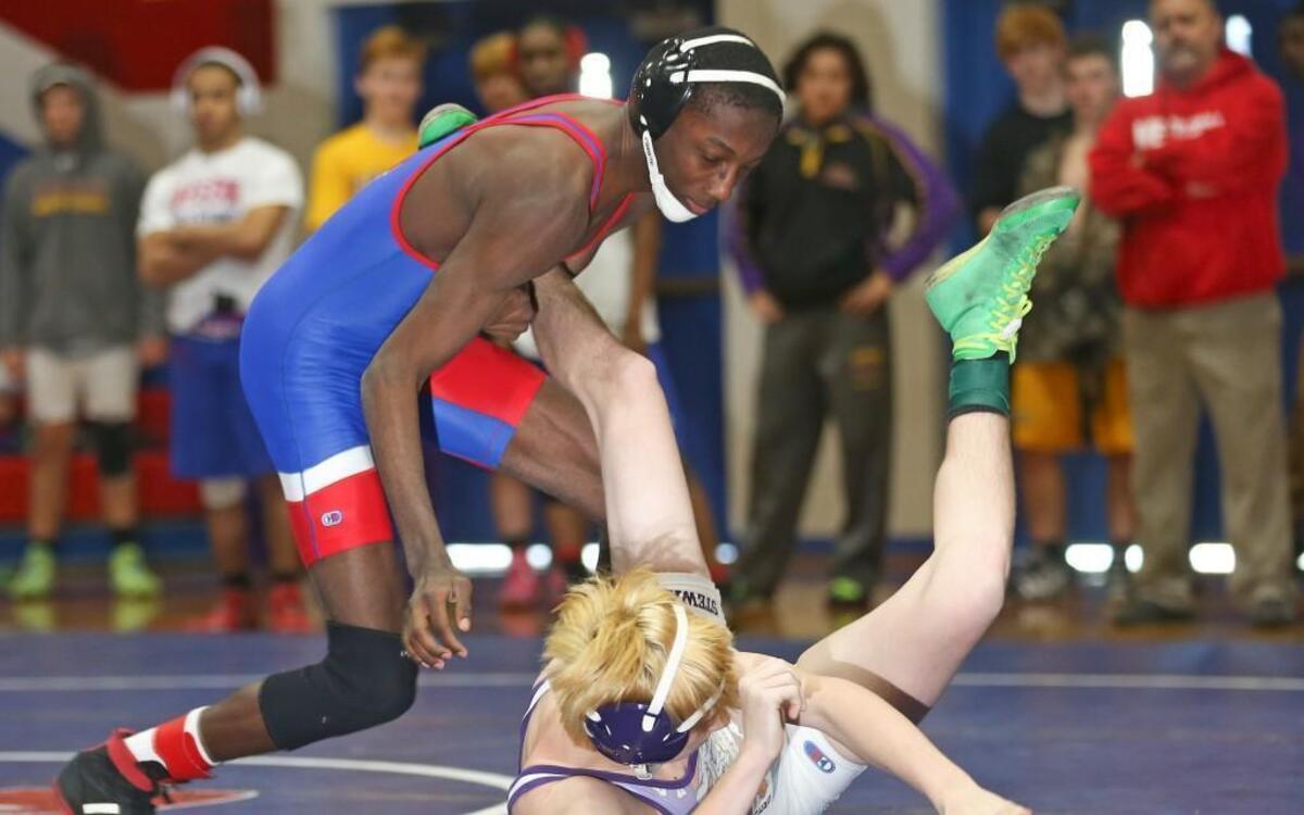 Western Harnett's Anthony Thompson (left) throws Cleveland's Gray Stewart to the mat and goes on to win the 113 pound championship. Coverage from the Two Rivers Conference Wrestling Tournament held at Western Harnett High School in Lillington, N.C. on Saturday, January 30, 2016. Western Harnett won the conference title with 9 championships.
