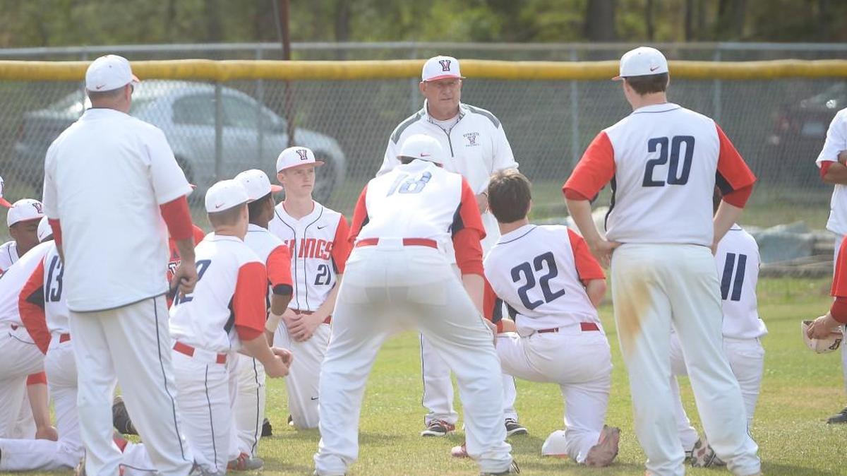 Pete Shankle, center, head coach of Voyager talks to his team at the end of the game. The Voyager Academy Vikings played the Oxford Prep Griffins in a baseball game that took place in Durham, N.C. on Saturday, March 25 2017. Voyager Academy won 9-2.