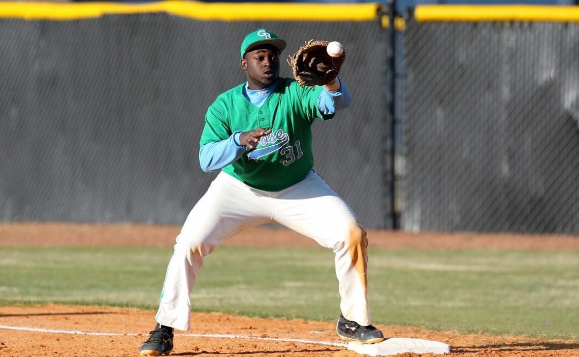 J.H. Rose's first baseman Tyshawn Barrett (31) makes the catch at first for an out during the J.H. Rose High School boy's baseball game against D.H. Conley High School in Greenville, N.C. on Thursday, March 16, 2017.