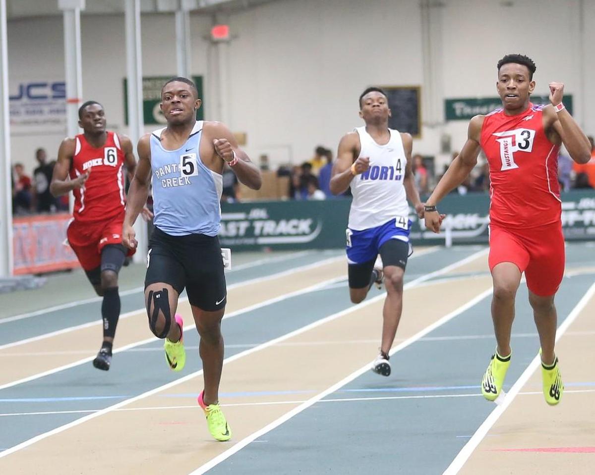 Panther Creek's J Johnson (5) edges out Parkland's Trequan Barnes (3) to win the Boys 300 Meter Championship. Coverage from the 4A NCHSAA State Indoor Championships held in Winston-Salem, N.C. on Saturday, February 11, 2017.