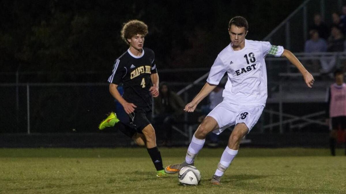 
East Chapel Hill’s Max Feldman moves the ball away from Chapel Hill’s Blake Johnson. The East Chapel Hill Wildcats and Chapel Hill Tigers played their soccer game in Chapel Hill, N.C. on Friday, October 16, 2015. The non-conference match ended 3-3.
