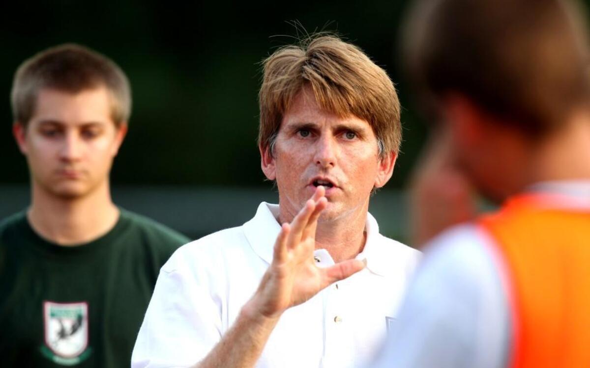 Coach Andrew Chadwick makes a point during practice for the Green Hope High School soccer team Wednesday August 11, 2010, at Green Hope High School.