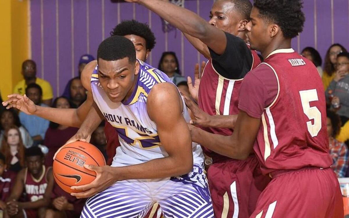 Word of God's Brandon Huffman (42) is defended by Mount Zion's R. Pantoplee (5) and A.Omino (20) during the first half. The Mount Zion Warriors took on the Word of God Holy Rams in Boys and Girls Basketball in Raleigh. N.C. on January 27, 2017. Word of God wins 77-61.