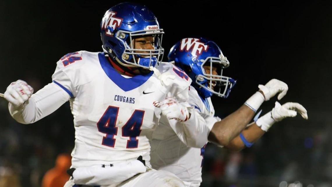Wake Forest's Darius Hodge (44) and Delante Lucas celebrate following Wake Forest's semi-final playoff game at Middle Creek on Friday, December 9, 2016. Wake Forest won the game 20-17 in overtime, and will play in the 4AA state championship.