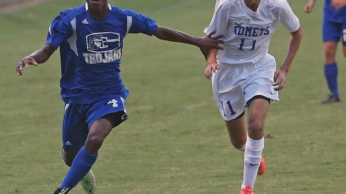 Garner’s Cisse Vakaba (4) makes a run down the sideline as Clayton defender Stephen Ruiz (11) tries to catch up in a Clayton win last season.