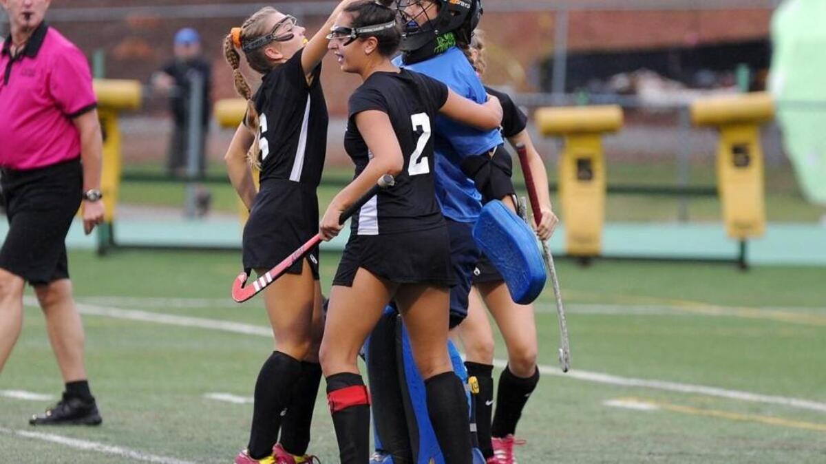 East Chapel Hill celebrates a save by goalkeeper Lydia Treml during the field hockey game against Cardinal Gibbons, which was played in Raleigh on Wednesday, September 21, 2016. East Chapel Hill won 3-1.