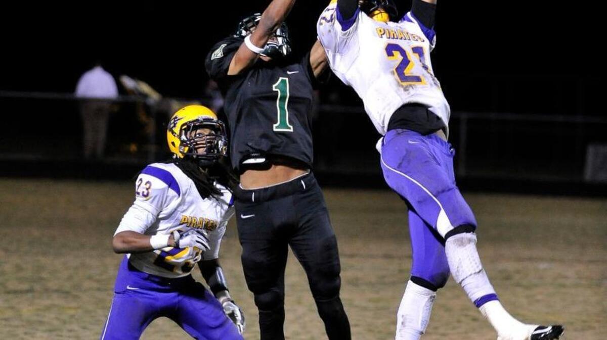 Corinth Holders' Steven Adams (21) intercepts a pass intended for South Johnston's Javonte Smith (1), during South Johnston's football game against Corinth Holders. Corinth Holders Wins 28-16. Friday, October 30, 2015. Benson N.C.