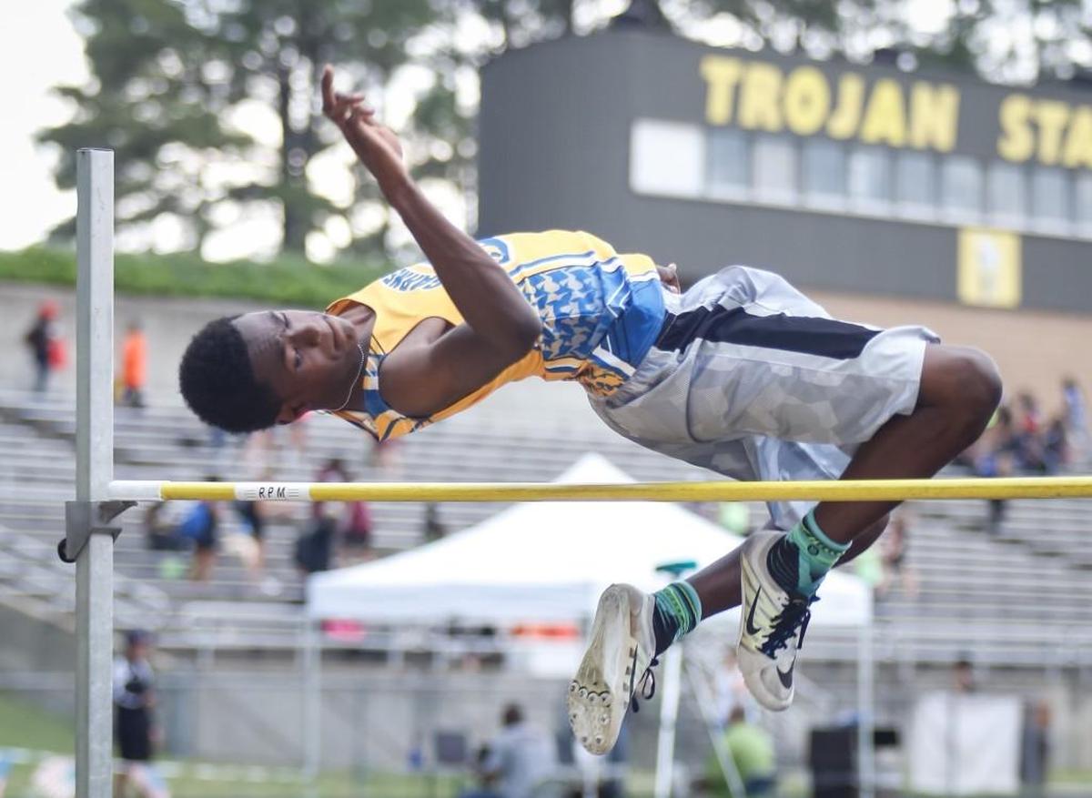 Garner's Randolph Ross clears a height of 5' 8" on his first attempt during the GNRC conference championships at Garner on Monday, May 2, 2016.