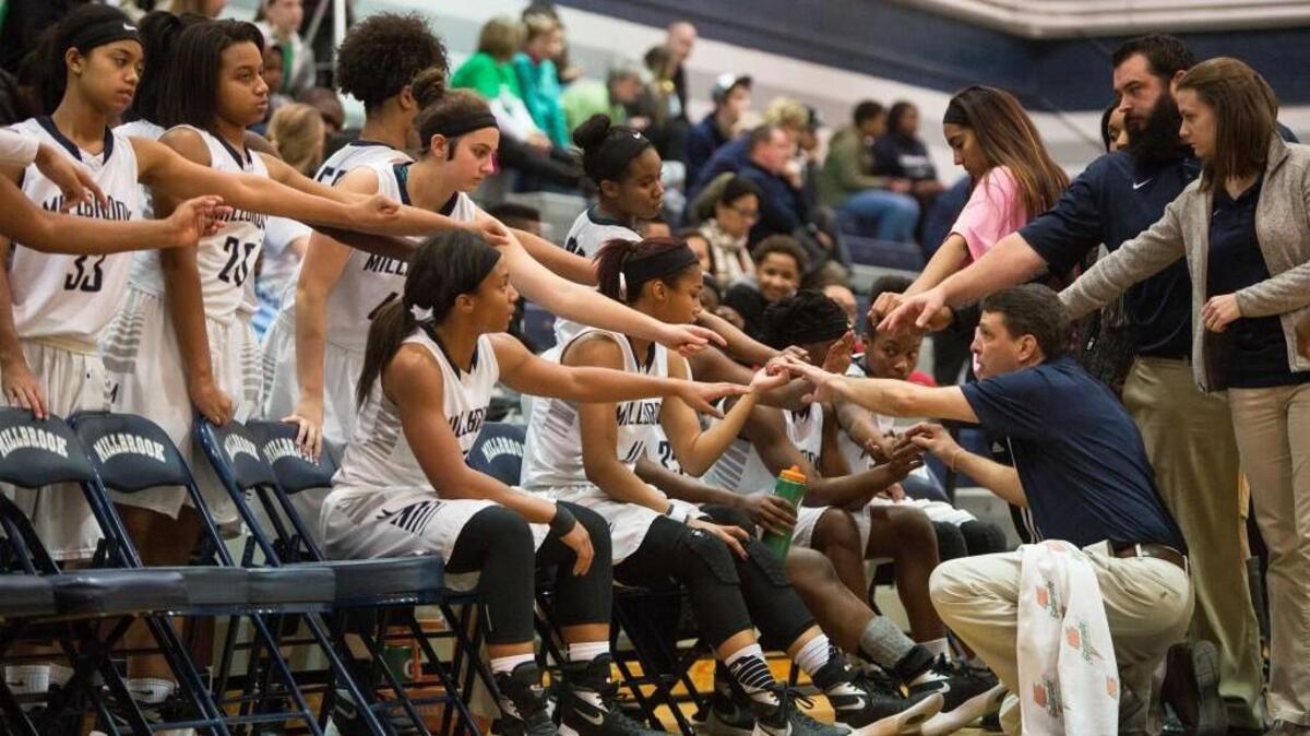 The Millbrook women's basketball team huddles during a timeout in a game against Leesville in Raleigh, N.C. on Thursday, Jan. 21, 2016. Millbrook enters the playoffs as the No. 1-ranked team in the N&O area rankings.