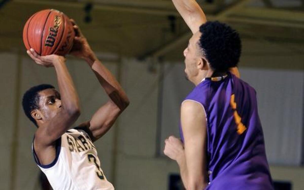 Smithfield-Selma’s Chris Turner (3) attempts a shot over Corinth Holders’ Kalen Cooper (1).