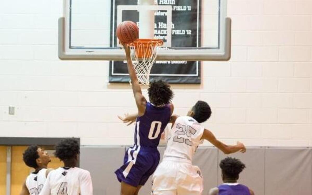 Oxford Prep's Deshawn Harper (0) gets a 3-point play during matchup between Oxford Prep and Granville Central that took place at Granville Central High School on December 16, 2016 in Stem, North Carolina. Granville Central girls defeated Oxford Prep 66-19. Oxford Prep boys defeated Granville Central 74-58.