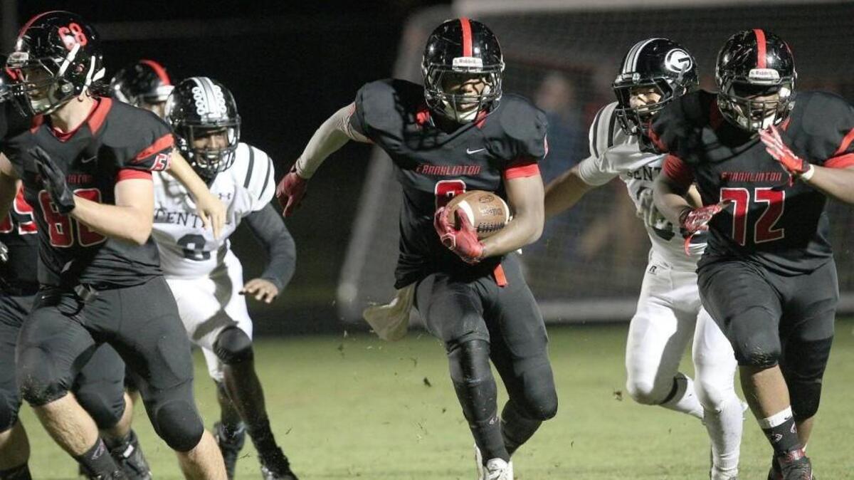 Franklinton's Ricky Person (8) runs thru a huge hole during the Granville Central High School football game against Franklinton High School, September,28, 2015 in , N.C. The score was 0-0 at the half.