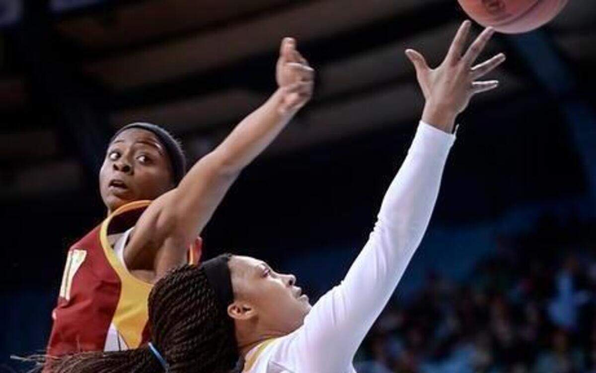 
Tamia Eatmon, right, of Chapel Hill scores with a layup against Sadasia Tipps, left, of Hickory. Chapel Hill Tigers played the Hickory Red Tornadoes at the Carmichael Arena in Chapel Hill, N.C. on Saturday, March 14, 2015. Hickory won 71-53.
