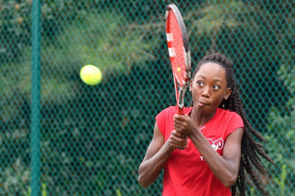 Rolesville freshman Jade Houston returns a serve during the No. 1 singles match in the Greater Neuse River 4A Conference girls tennis match against East Wake in Wendell, N.C. on Monday, Sept. 26, 2016.