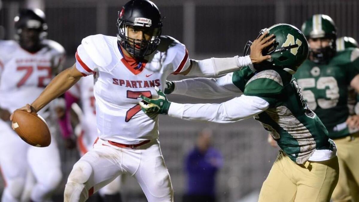 Jalen Greene (7) of Southern stiff arms Michael Hayes, right, of Northwood to score a touchdown for the Spartans. The Northwood Chargers played the Southern Spartans in a football game that took place in Pittsboro, N.C. on Friday, October 21, 2016. Southern won 46-28.