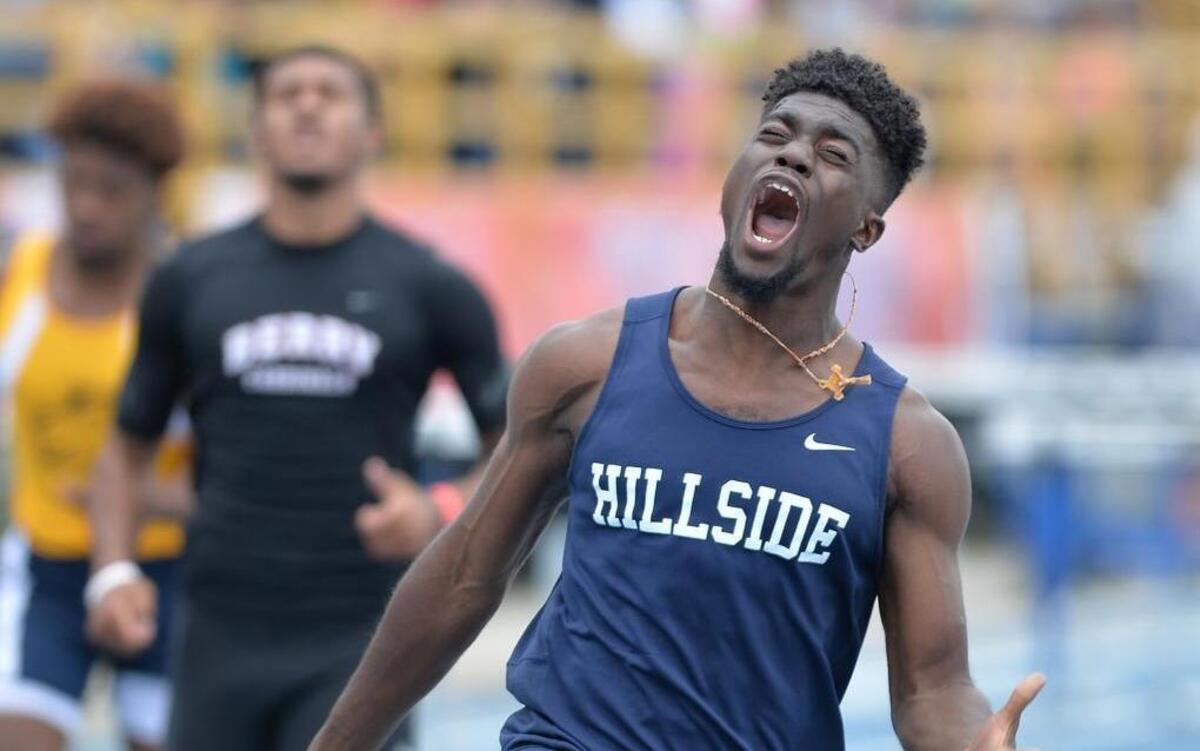 Marcus Krah of Hillside celebrates after winning the Boys 110 Meter Hurdles 4A during the NCHSAA 4A Track and Field Championships that took place at the North Carolina A&T State University in Greensboro, N.C. on Saturday, May 21, 2016.