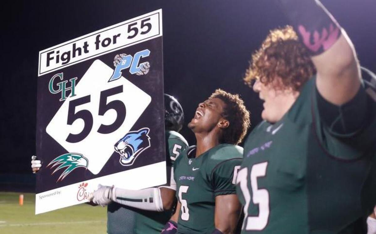 
Green Hope players, from left, Keanu Gonzales (51), Bryce Dixon (6) and Hudson Ressler (75) celebrate following Panther Creek's football game at Green Hope on Friday, October 9, 2015. Green Hope won the game 28-27.
