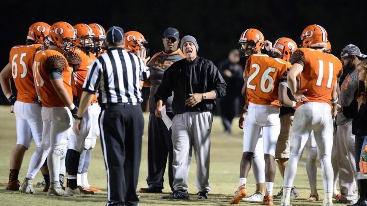 Pat Moser, center, head coach of Orange reacts to a referee's call during the second half. The Orange Panthers played the Havelock Rams in a football game that took place in Hillsborough, N.C. on Friday, November 25, 2016. Havelock won 14-7.