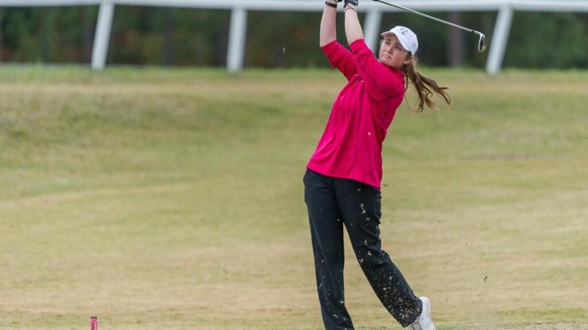 Meghan McPeak of Carrboro High School tees off on a par 3 during day one of the 2015 NCHSAA 1A/2A girls golf championships at Longleaf Golf & Family Club in Southern Pines, NC on Monday, October 26.