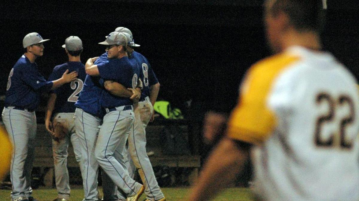 Erwin Triton coach Joey Miriello embraces Adam Capps (9) after he recorded the final out with a strikeout in relief in a 3-A state playoff game against Chapel Hill on Wednesday, May 10, 2017. Triton won 5-2 in eight innings.