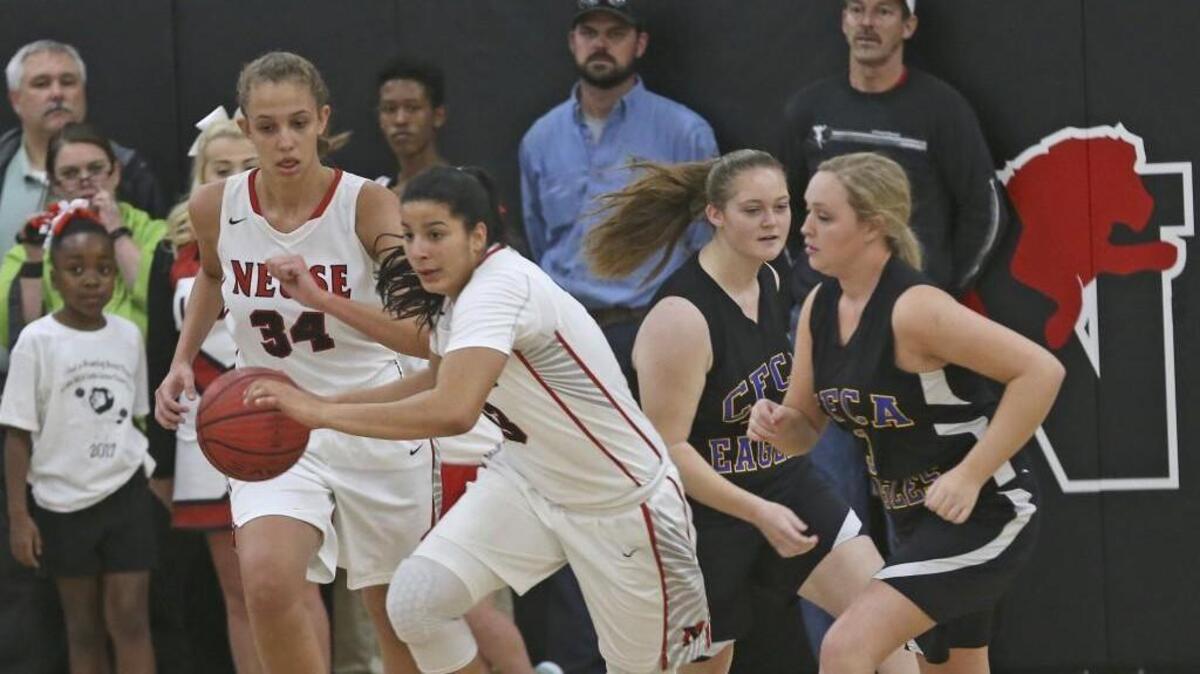 Neuse Christian's Izabela Leite (33) and Izabel DeAngelo (34) starts fast break on Cape Fear's Kris Anna McLamb's (3). Coverage from the prep basketball games between the Neuse Christian Academy Lions and the Cape Fear Christian Academy Eagles played in Raleigh, N.C. on Friday, January 27, 2017. The Neuse Christian Academy Girls defeated Cape Fear Christian Academy 51-27 and the Cape Fear Boys defeated Neuse Christian 102-94.