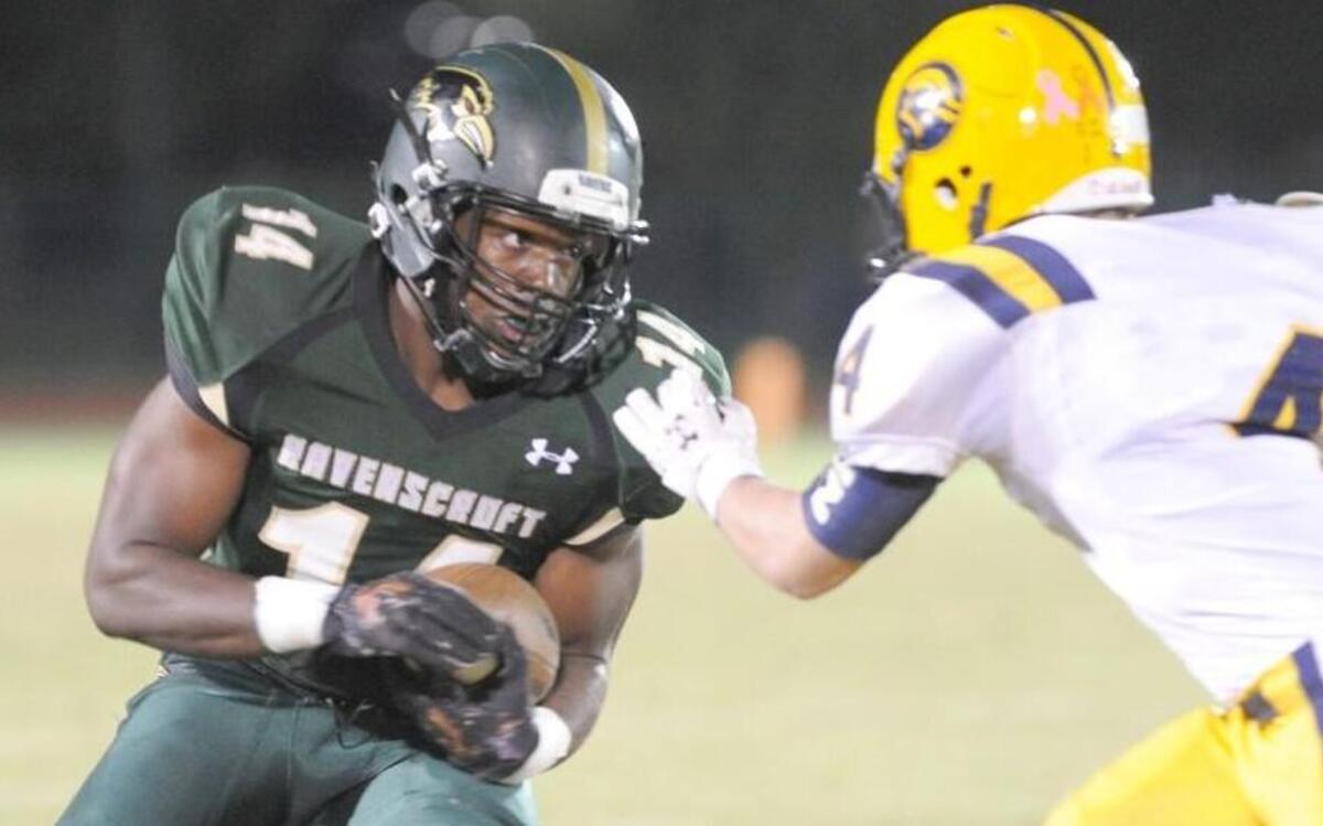 
Ravenscroft’s DJ Washington (left) is tackled by North Raleigh Christian's Mike Jerrett (4) during the football game, which was played on Friday, October 16, 2015 in Raleigh.
