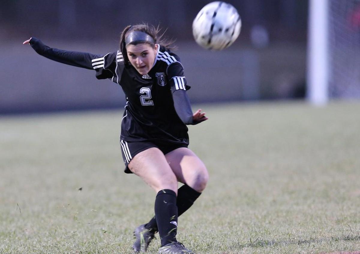 Wakefield's Kaitlyn Bouck (2) kicks the ball goalward during the Sanderson Spartan high school soccer game with the Wakefield Wolverines high school , March 16, 2017, in Raleigh , N.C.