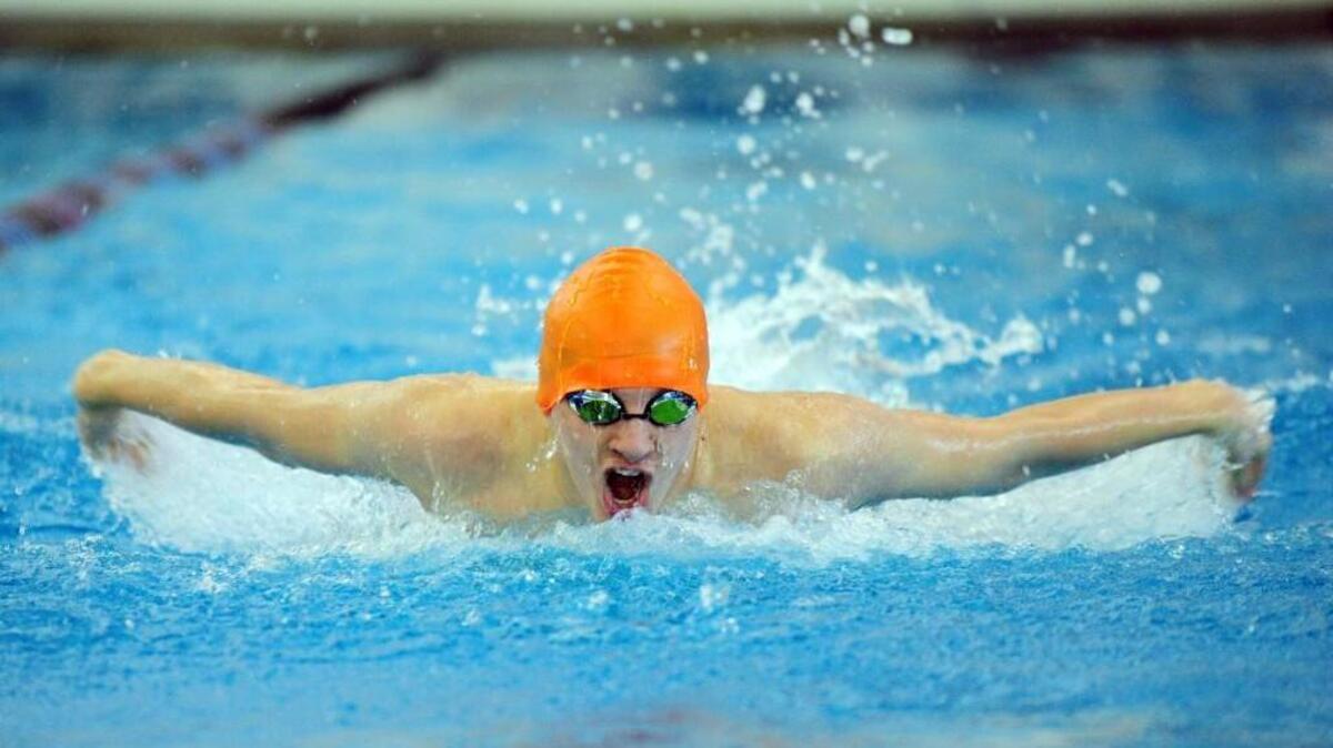 Grace Christian's Eric Jordan swims the 100 yard butterfly during the Eastern Plains Independent Conference swimming championships in Cary on Tuesday, February 2, 2016.