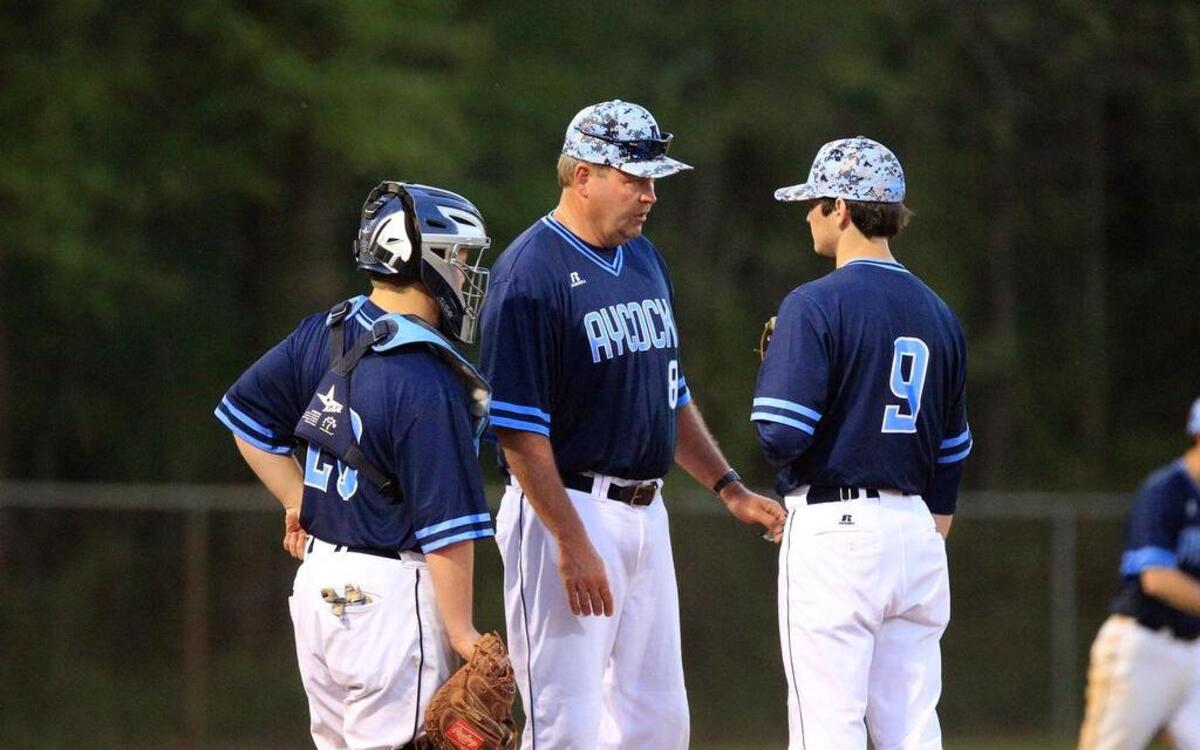 C.B. Aycock Golden Falcons baseball coach Charles Davis comes out to the mound to talk to his pitcher and catcher in an April 11, 2017 game against the Southern Wayne Saints.
