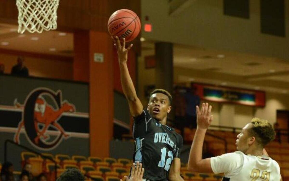 Overhills’ Joshua Richmond (12) goes up for basket against Harnett Central's Kaizer Ray (44) and Marquise Longmire (23) during the Boys Championship game of the Harnett County Tip-Off Tournament at Campbell University in Buies Creek, NC on Friday November 18, 2016.