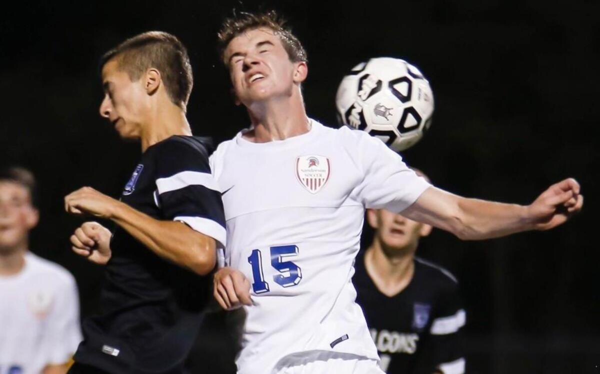 
Green Hope's Daniel Gutierrez, left, competes for a header with Sanderson's Matt Dubach (15) during Green Hope's soccer game at Sanderson on Tuesday, August 25, 2015. 
