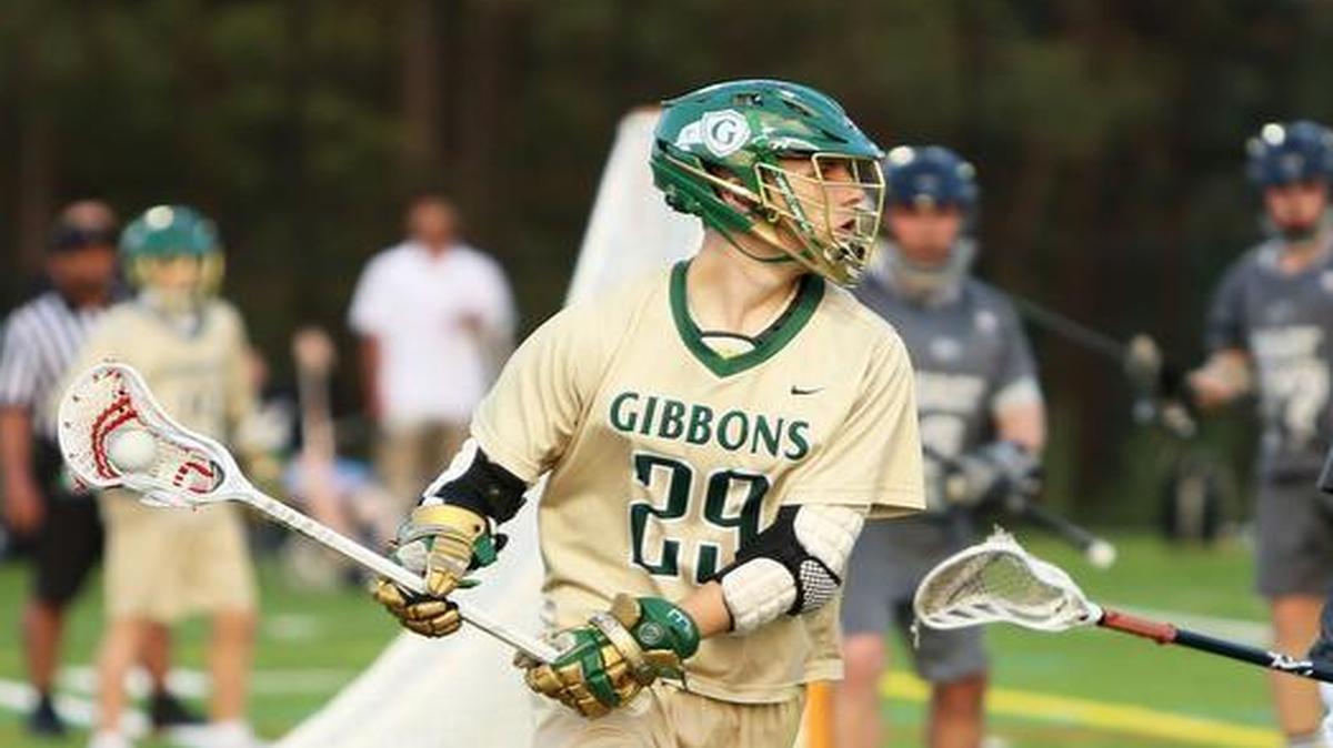 Gibbons' Mike LiVigni (29) looks for an open pass during the Cardinal Gibbons men's lacrosse team's 16-2 win over the East Chapel Hill Wildcats at Cardinal Gibbons High School in Raleigh, N.C., Tuesday, March 21, 2017.