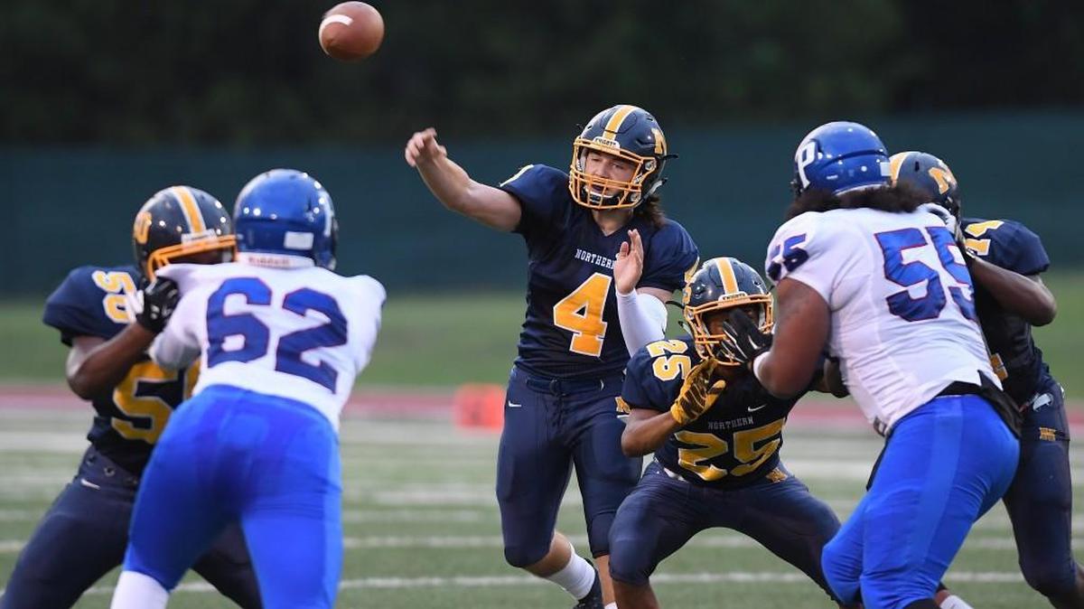Brycen Jackson (4) of Northern throws a pass during the first half. The Northern Knights played the Person Rockets in a football game that took place in Durham, N.C. on Friday, August 26 2017.