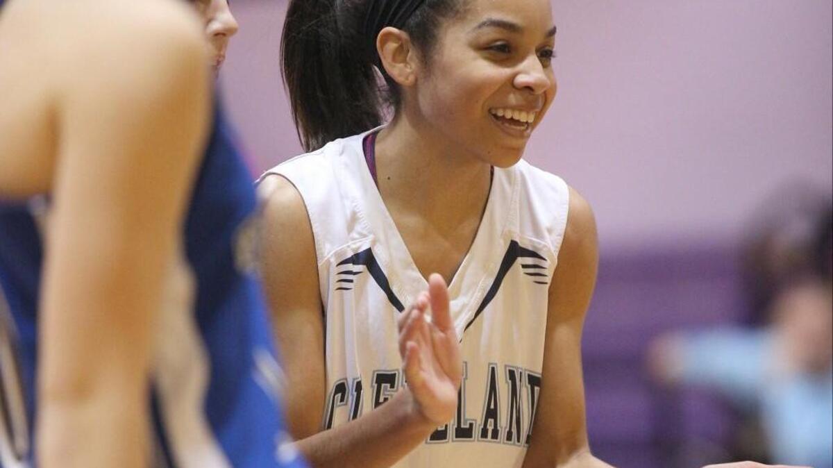 Cleveland’s Miranda Hinton (21) smiles as her team pulls away from Triton during the Two Rivers 3A Conference tournament championship game. The Rams and Hinton were 12-0 against conference opponents this season.