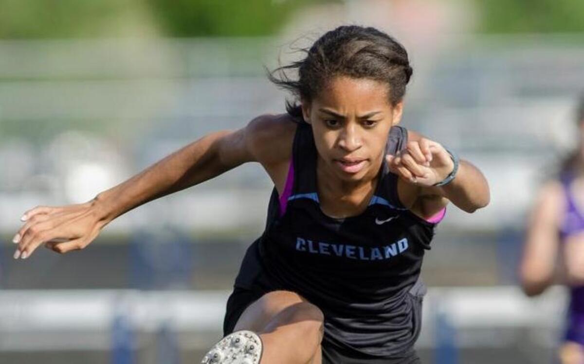 Cleveland's Sydni Fields takes a 1st place finish in The girl's 300 meter hurdles, with a time of 48.0, during the Two Rivers Conference 3A Track and Field Championship.