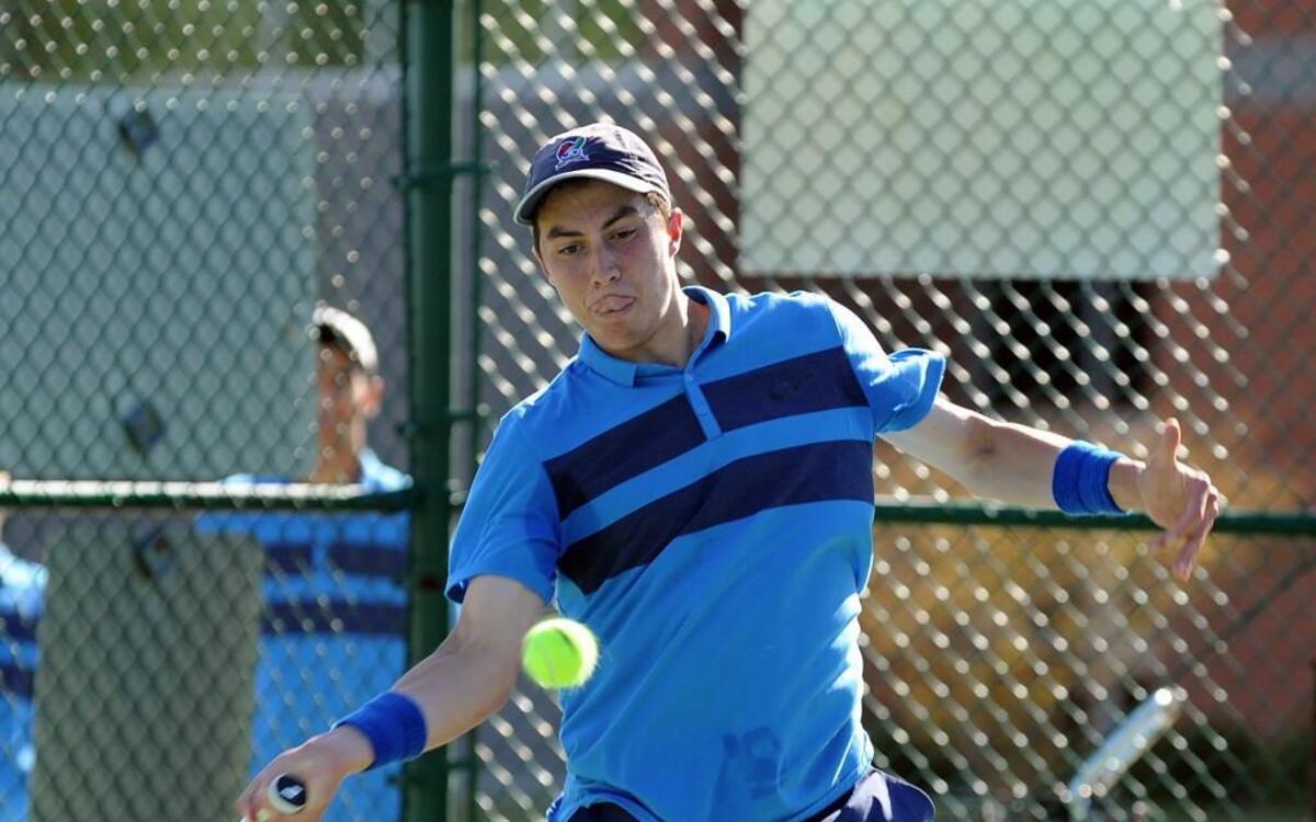 Panther Creek's Andrew “Trice” Pickens hits at the baseline during the boys tennis match against Middle Creek, which took place in Cary on Monday, April 4, 2016.