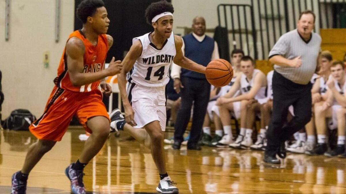 East Chapel Hill’s Carter Collins is on the fast break with Orange’s Demares Drummond defending on Tuesday, December 1, 2015. East Chapel Hill won 47-35.