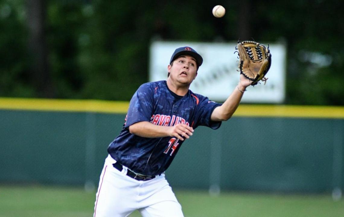 Southern Lee's Topher Grant(14) makes catch and throws to first for out during game with Lee County. The Lee County Yellow Jackets took on the Southern Lee Cavaliers in a regular season CFVC baseball game in Sanford, N.C. on April 21, 2017. Southern Lee won 5-1.