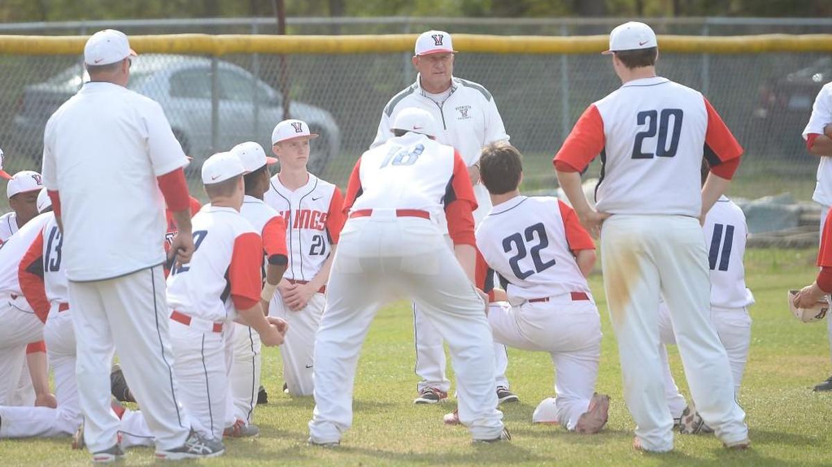 Pete Shankle, center, head coach of Voyager talks to his team at the end of the game. The Voyager Academy Vikings played the Oxford Prep Griffins in a baseball game that took place in Durham, N.C. on Saturday, March 25 2017. Voyager Academy won 9-2.