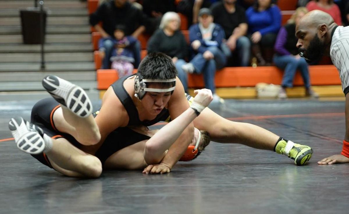 Braden Homsey, left, of Orange wrestles Jesus Banda, right, of Chapel Hill at 182 lbs. during the dual team wrestling match between the Orange Panthers and the Chapel Hill Tigers that took place in Hillsborough, N.C. on Thursday, January 26, 2017. Orange won 42-27.