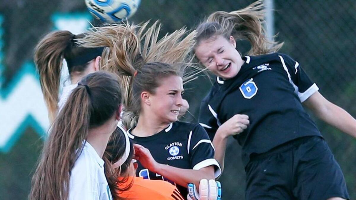 Clayton’s Holland Mills (6) heads a corner toward goal off of a corner kick. Coverage from the prep girls soccer game between the Clayton Comets and the West Johnston Wildcats played in Benson, N.C. on Monday, April 4, 2016. Clayton defeated West Johnston 11-3.